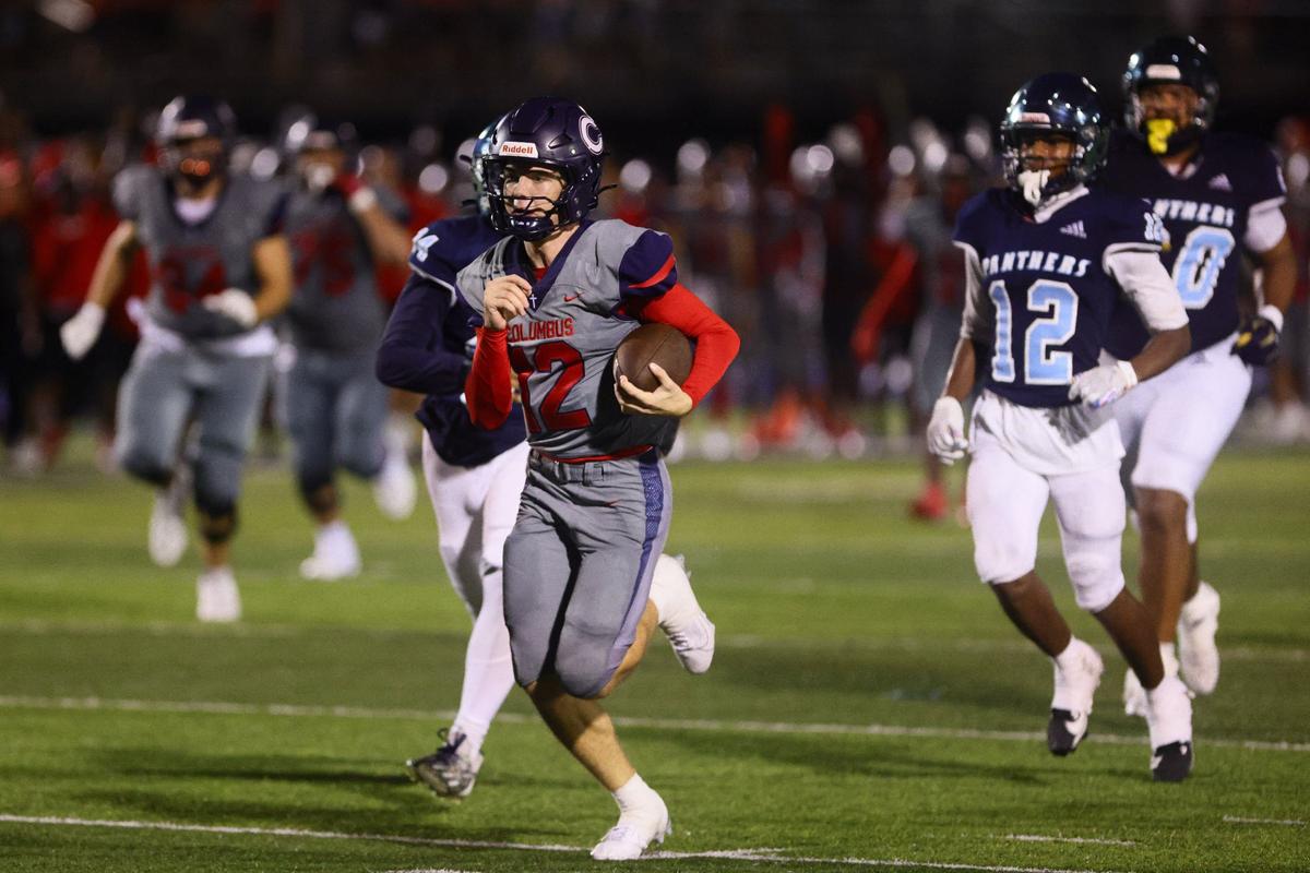 Columbus Explorers quarterback Jason Barket (12) runs with the football for a touchdown against the Palmetto Panthers during the third quarter of a high school football game at Tropical Park Stadium in Miami, Florida, on Friday, September 13, 2024.