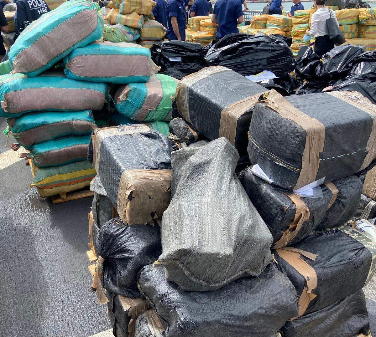 Packages of cocaine and marijuana are stacked on the deck of the U.S. Coast Guard Cutter James Thursday, Feb. 17, 2022.