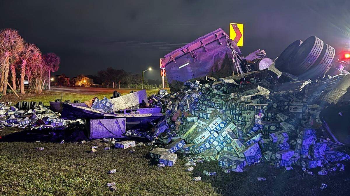 A large quantity of beer spilled out of an overturned semitruck, closing a Florida road for hours, officials said.