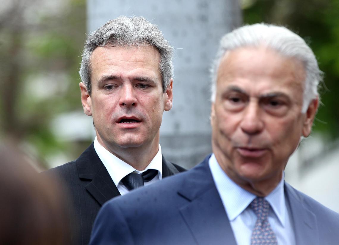 Attorney Roberto Martinez joined Mickael Behn, left, a holder of certified claims for land in Cuba and a plaintiff in the first lawsuit under the Helms-Burton Act, outside of the Wilkie D. Ferguson Jr. U.S. Courthouse.