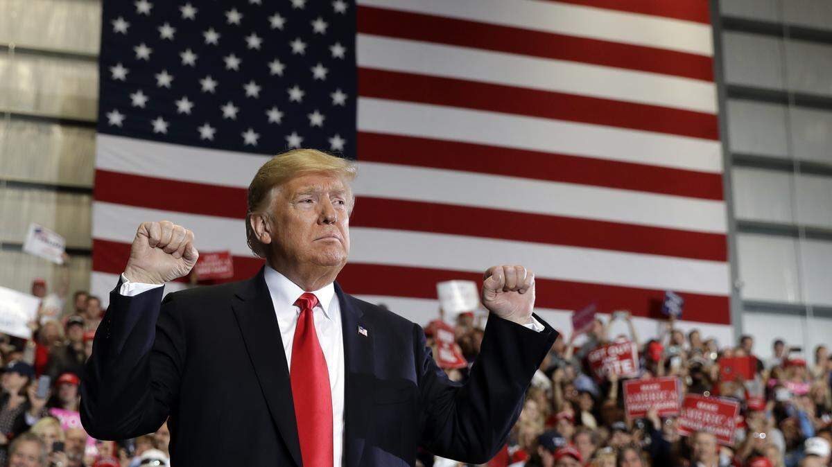 President Donald Trump looks to the crowd after speaking at a campaign rally at Pensacola International Airport, Saturday, Nov. 3, 2018, in Pensacola, Fla.