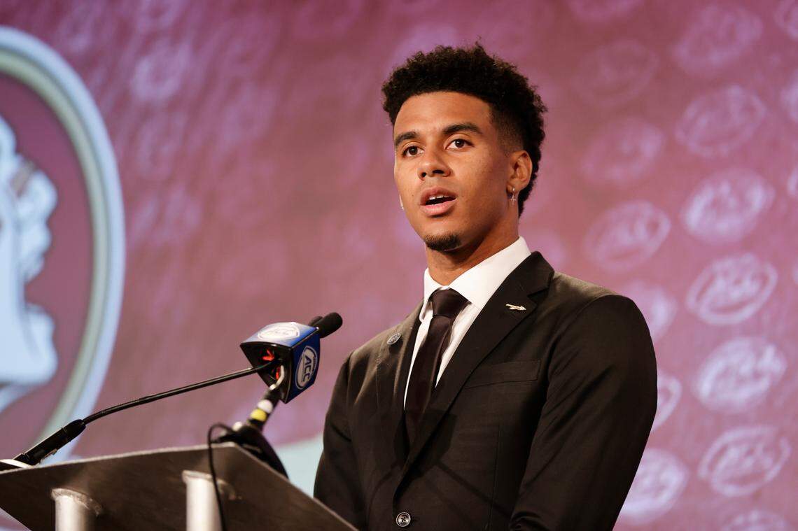 Florida State quarterback Jordan Travis answers a question at the NCAA college football Atlantic Coast Conference Media Days in Charlotte, N.C., Wednesday, July 20, 2022.