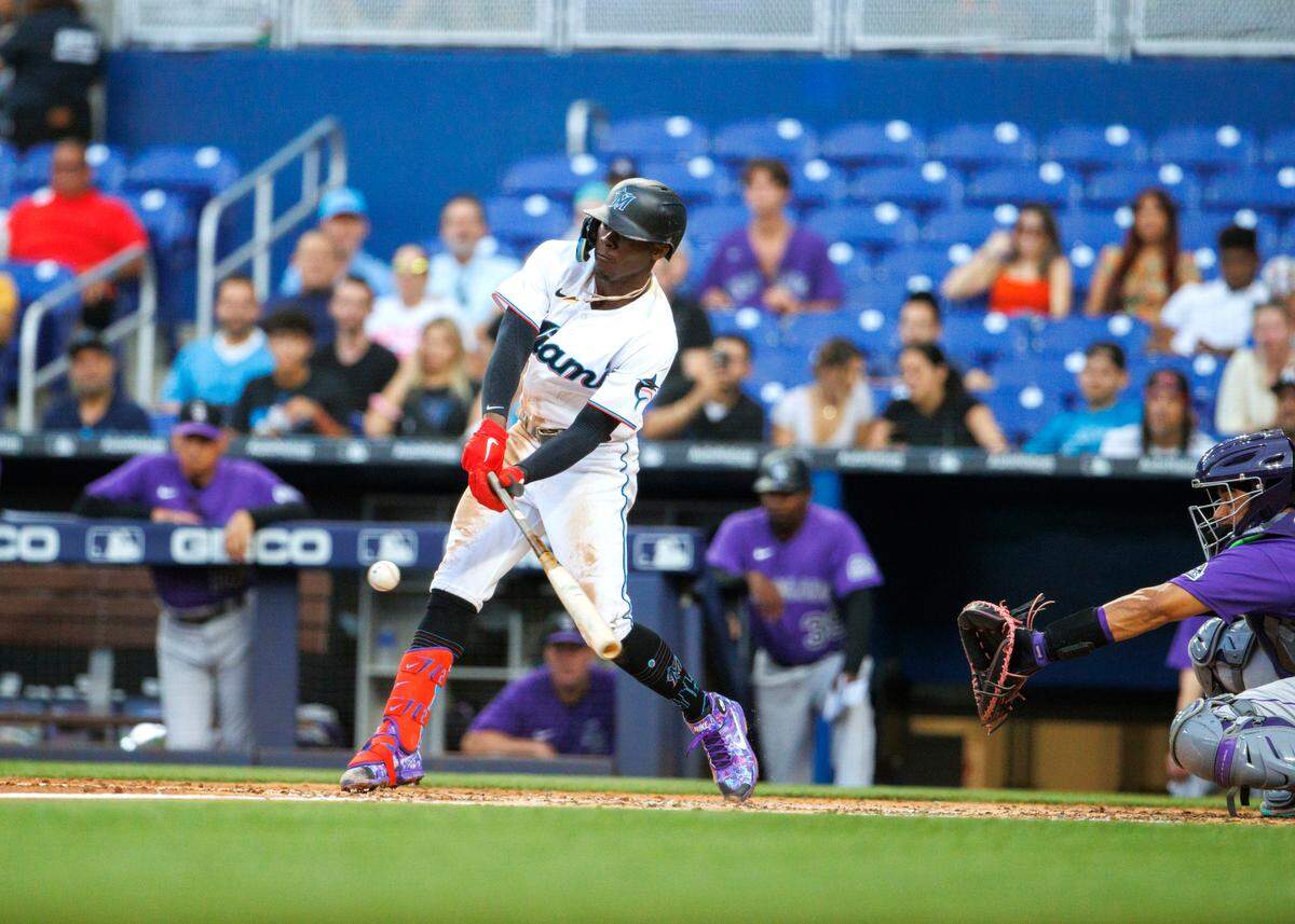 Miami Marlins second baseman Jazz Chisholm Jr. (2) hits a RBI single during the third inning of a baseball game against the Colorado Rockies at LoanDepot Park on Wednesday, June 22, 2022 in Miami, Florida.