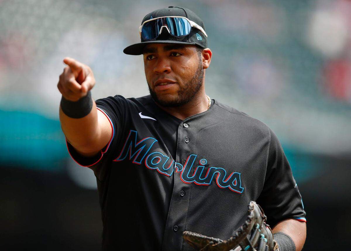 Jesus Aguilar #24 of the Miami Marlins motions to the Atlanta Braves bench in the first inning of an MLB game at Truist Park on April 15, 2021 in Atlanta, Georgia. All players are wearing the number 42 in honor of Jackie Robinson Day.