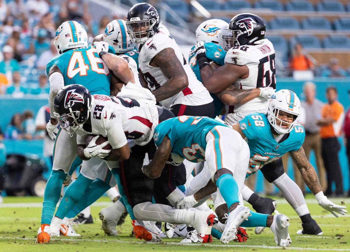 Atlanta Falcons running back Carlos Washington Jr. (28) scores a touchdown against the Miami Dolphins in the first quarter of their NFL pre-season football game at Hard Rock Stadium on Friday, Aug. 9, 2024, in Miami Gardens, Fla.