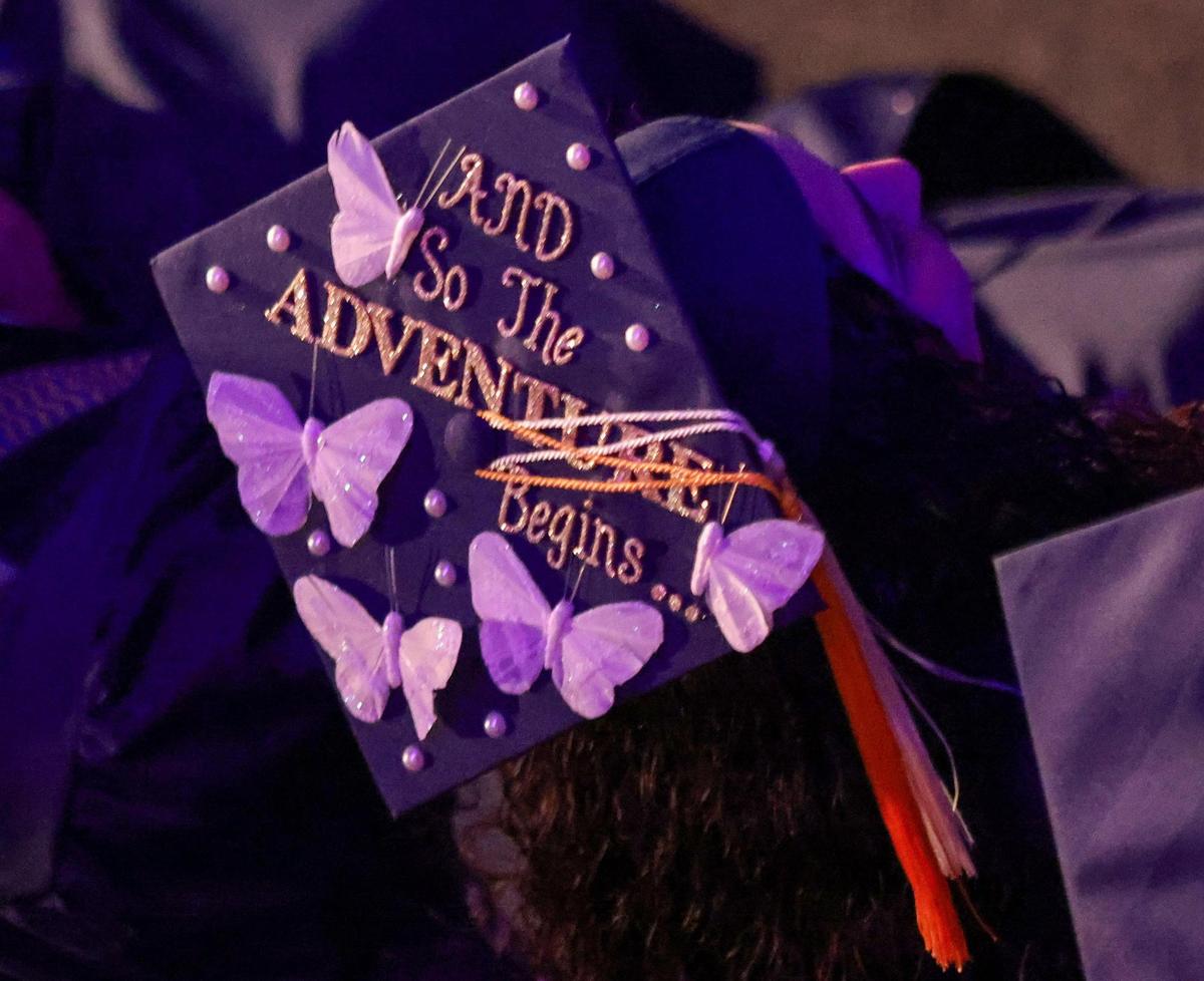 A students rocks a hopeful cap during the second of 10 ceremonies at FIU this spring. 