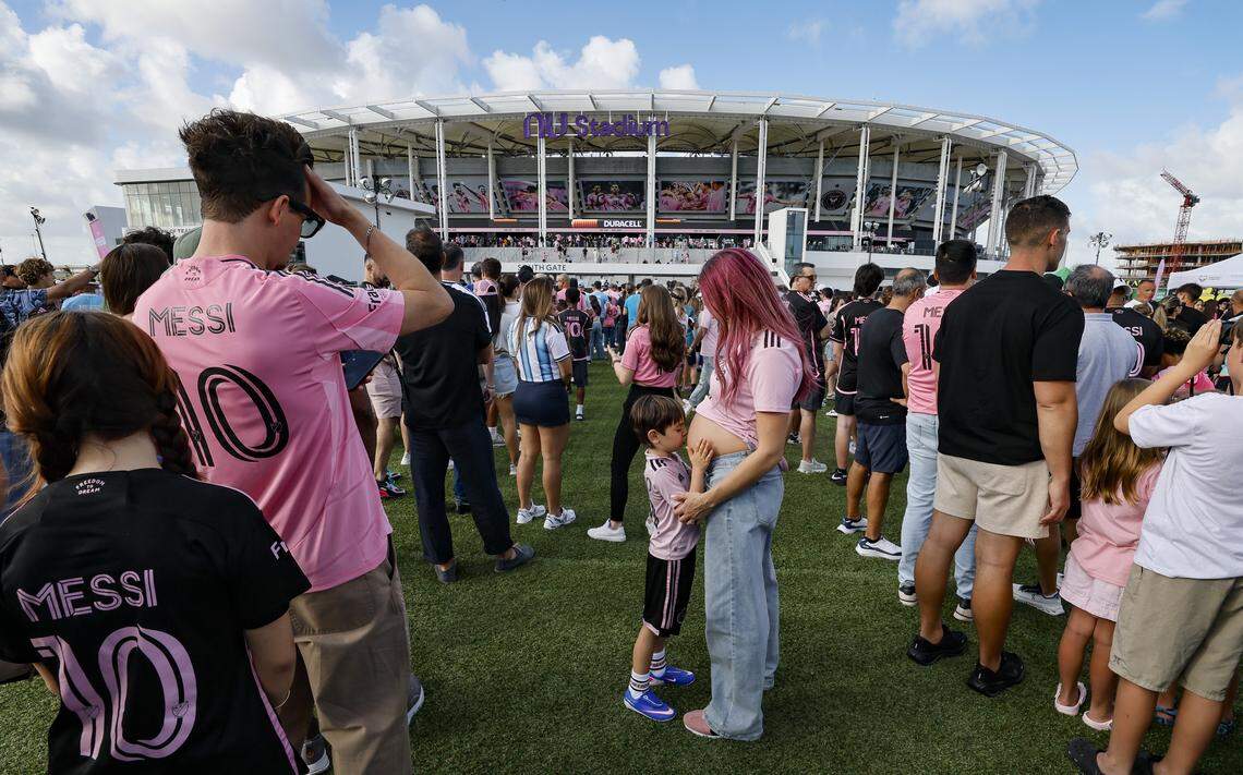 Thiago J. Breit, 5, kisses his pregnant mother, Sheila Breit as they wait in line to watch the MLS soccer match between  Inter Miami CF and Austin FC at Nu Stadium in Miami Freedom Park on Saturday, April 4, 2026, in Miami, Florida, 