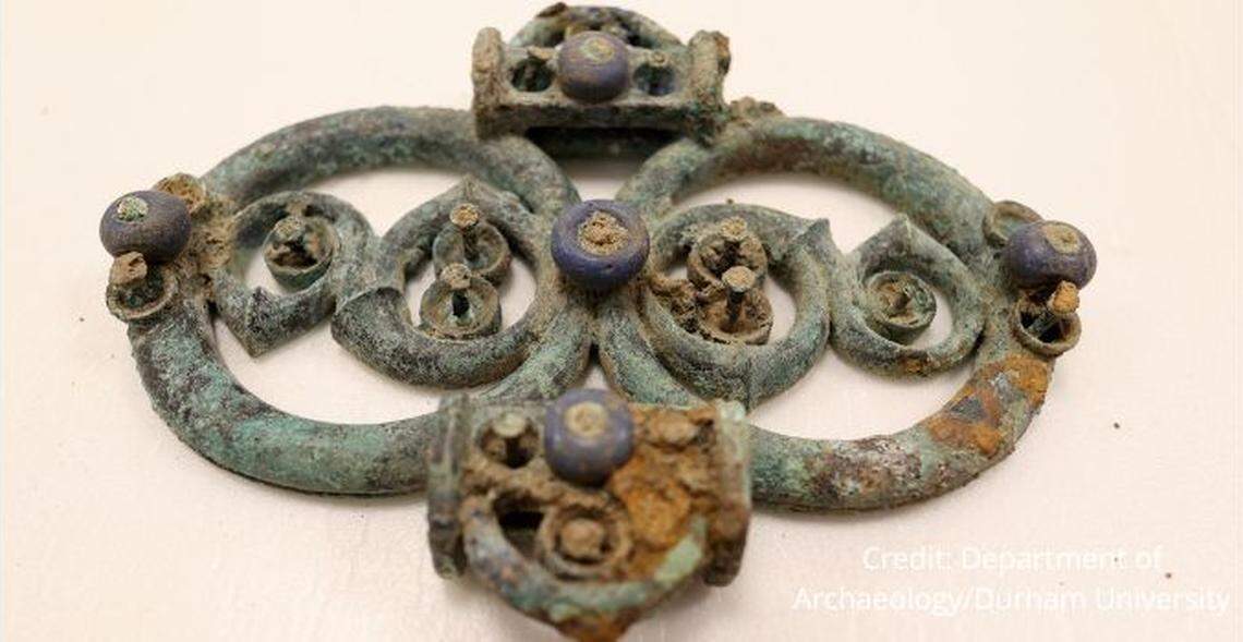 A harness fitting with blue decorations was among the discovered items.