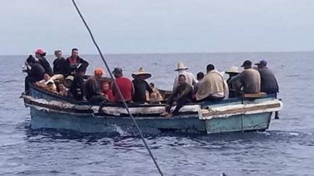 A migrant vessel floats about 12 miles south of the Middle Florida Keys city of Marathon, Sunday, June 26, 2022. A woman was found dead on another migrant boat the Coast Guard stopped off Key West Tuesday, June 21, 2022.