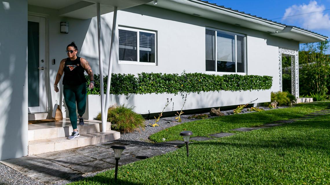 Ani Meinhold, an owner of restaurant Phuc Yea, wears gloves and leaves orders at the door to reduce contact during the coronavirus outbreak.