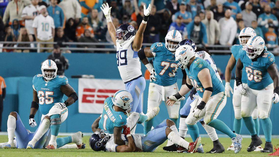 Miami Dolphins quarterback Tua Tagovailoa (1) is sacked by Tennessee Titans linebacker Harold Landry III (58) late in the fourth quarter at Hard Rock Stadium in Miami Gardens, Florida on Monday, December 11, 2023.