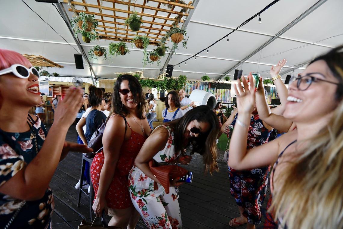 Tara Alicea, center, and her friends enjoy the Cinco de Mayo celebration at Wynwood Marketplace in 2019.