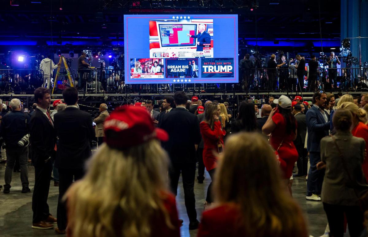 Guests watch election results live during Republican presidential nominee Donald Trump’s election night party at the Palm Beach County Convention Center on Tuesday, Nov. 5, 2024, in West Palm Beach, Florida.