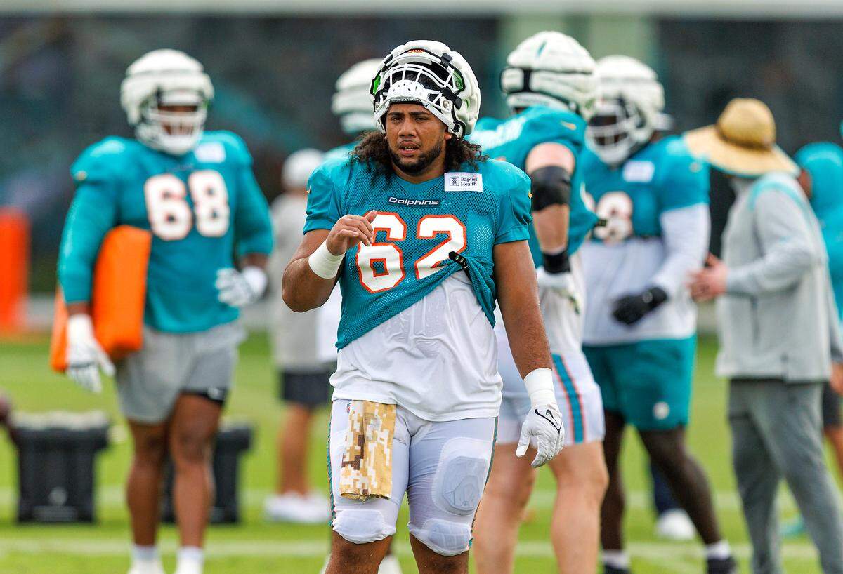 Miami Dolphins center Alama Uluave (62) looks on during a joint practice with the Atlanta Falcons at Baptist Health Training Complex in Hard Rock Stadium on Wednesday, August 9, 2023 in Miami Gardens, Florida.
