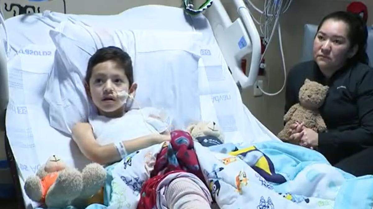 Santiago Claudio, 9, and his mother, Monica Carrillo, at HCA Florida Kendall Hospital. Santiago suffered second- and third-degree burns to about 18% of his body. 