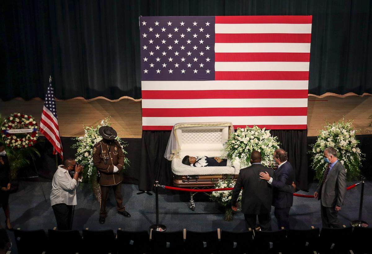 On Sunday, December 5, 2021 Kendrick Meek, left, receives condolences from brothers Lincoln and Representative Mario Diaz-Balart (R-FL), right, during the viewing ceremony for Carrie Meek at Booker T. Washington in Miami, Florida.