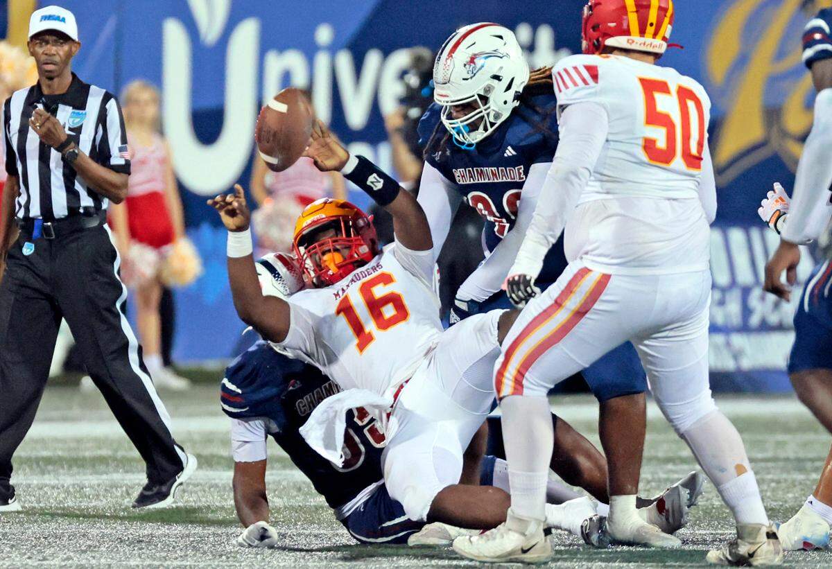 Chaminade-Madonna’s Matthew Pointer (55) and Anthony Smith (99) take down Clearwater Central Catholic’s quarterback Khayse Barrett (16) as he loses the ball in the first half of the Florida High School Football State Championships - Class 1A game at Pitbull Stadium on the campus of Florida International University in Miami, Florida, on Wednesday, December 11, 2024.