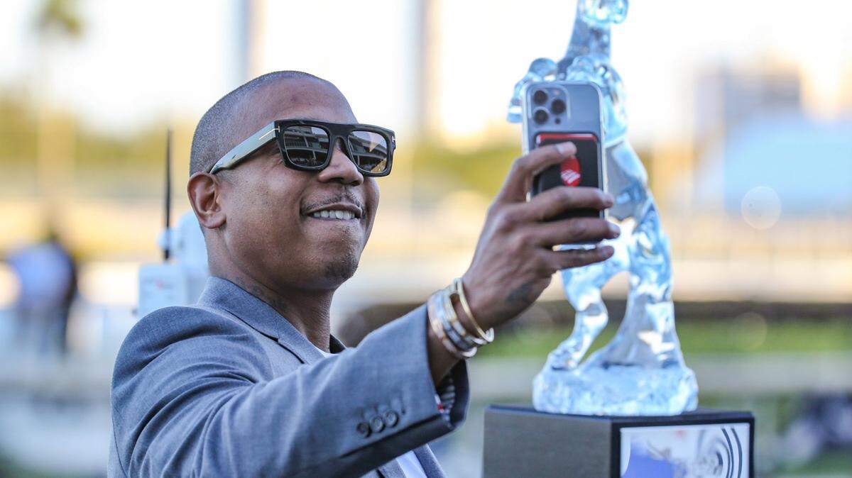Rapper and actor, Jeffrey Bruce Atkins, better known as Ja Rule takes a selfie next to the Pegasus World Cup trophy at Gulfstream Park in Hallandale Beach on Saturday, January 29, 2022.
