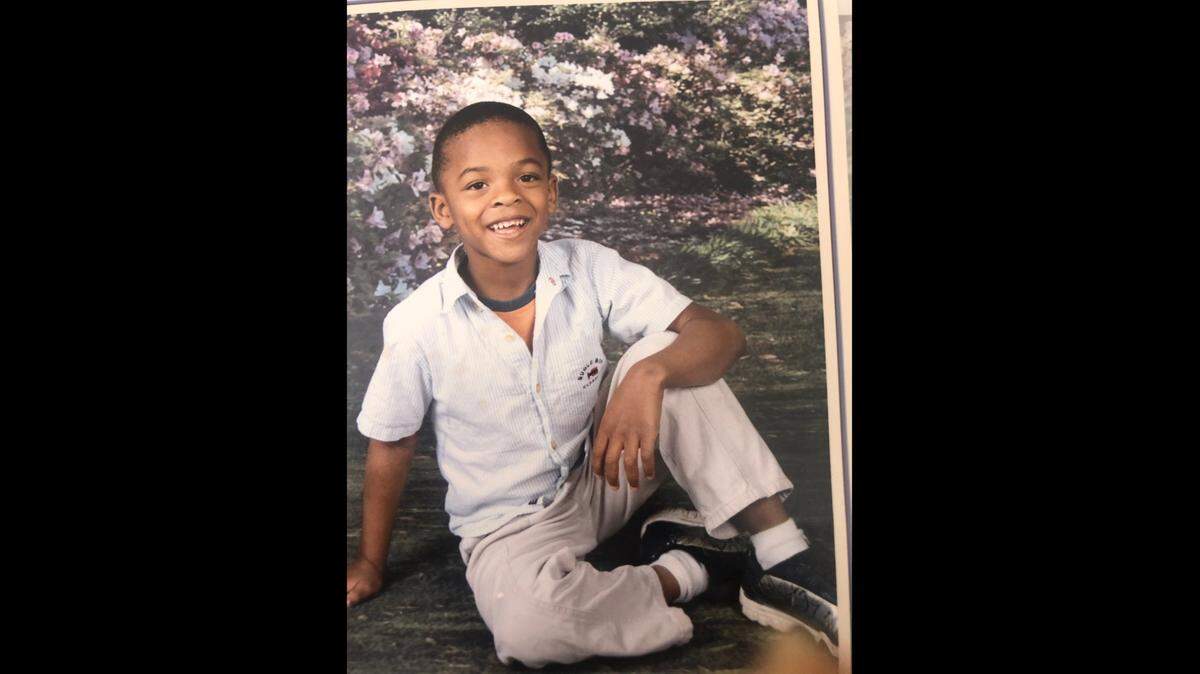 Greg Rousseau is shown at age 5.