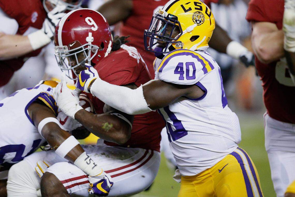 Alabama running back Bo Scarbrough is tackled by LSU linebacker Devin White during the first half of an NCAA college football game, Saturday, Nov. 4, 2017, in Tuscaloosa, Ala.