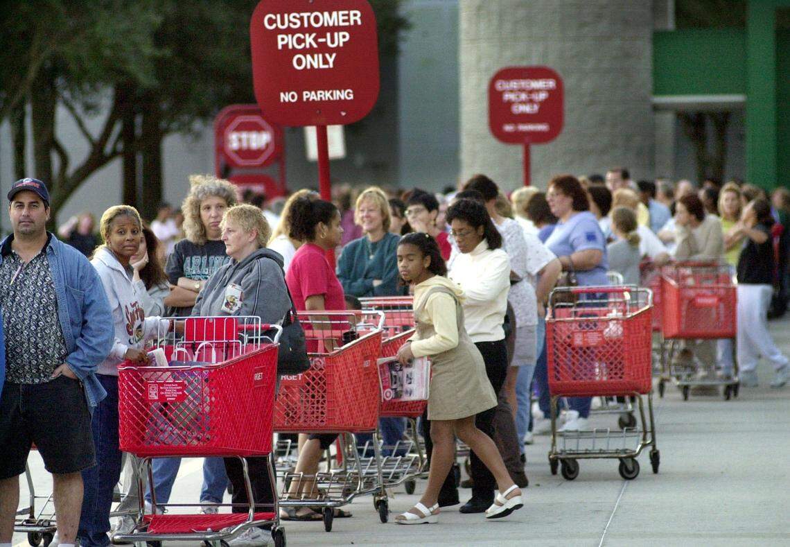 Early morning shoppers line up outside the Sawgrass Mills Target store waiting for it to open.