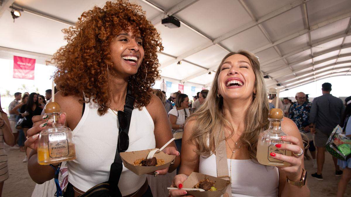 Guests at the 2024 South Beach Wine and Food Festival enjoy the Grand Tasting Village. Tickets for Saturday’s Grand Tasting are sold out, but Sunday tickets are still available.