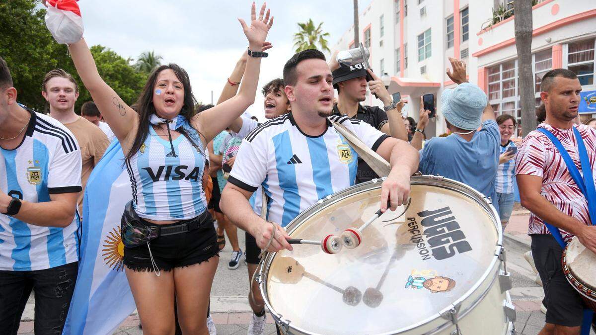 Fans rooting for Argentina celebrate winning the World Cup final against France in Miami Beach, Florida, Sunday, December 18, 2022.