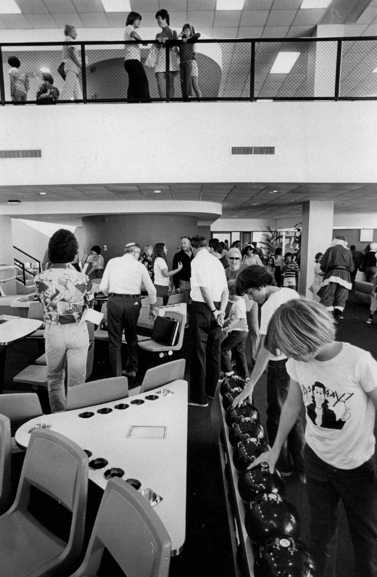 Youngsters inspect bowling balls on one of the six lanes a 1976 open house at the new Miami Beach Youth Center.