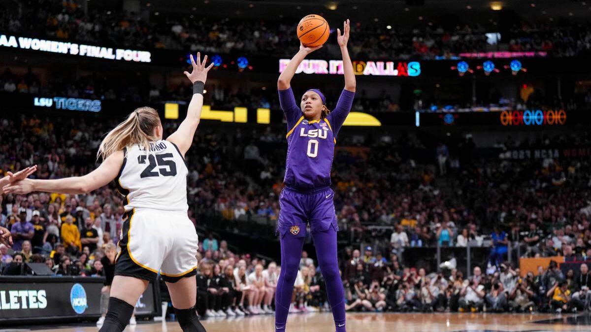Apr 2, 2023; Dallas, TX, USA; LSU Lady Tigers forward LaDazhia Williams (0) attempts a three-point basket against Iowa Hawkeyes forward Monika Czinano (25) in the second half during the final round of the Women’s Final Four NCAA tournament at the American Airlines Center. Mandatory Credit: Kirby Lee-USA TODAY Sports