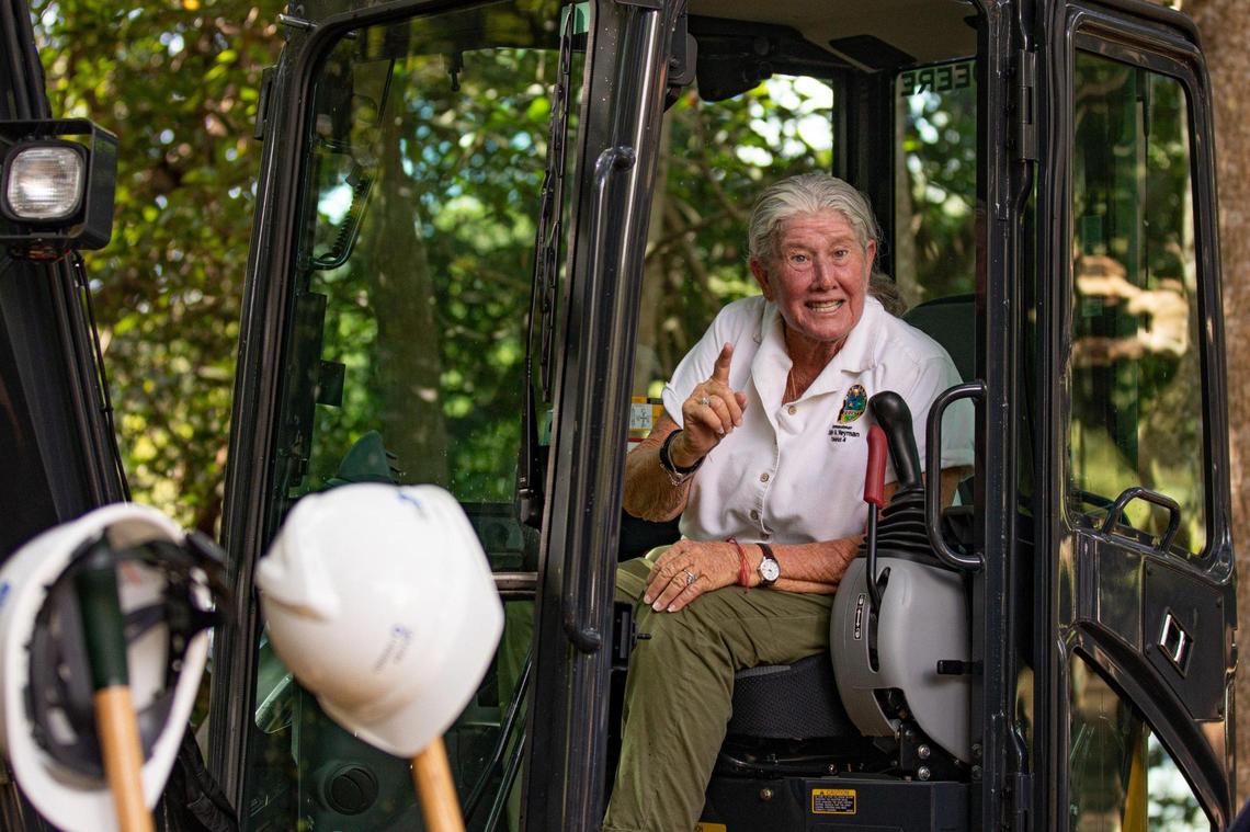 Miami-Dade County Commissioner Sally Heyman sits in a bulldozer after breaking ground on the Ojus Sanitary Sewer Expansion Project at Greynolds Park in North Miami Beach, Fla., on Wednesday, Aug. 31, 2022.