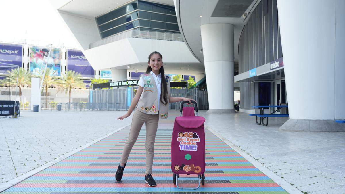 Girl Scout Sophia Z., with her cookie cart, was a top seller in 2024.