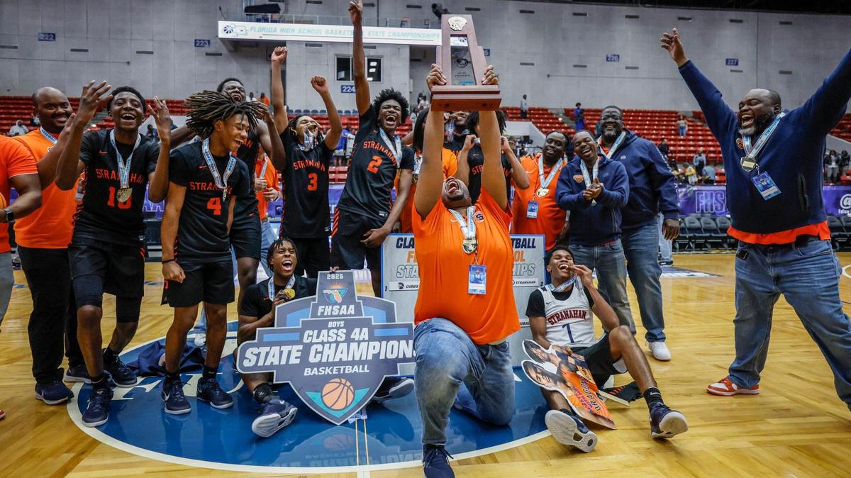 Stranahan High School players and coaches celebrate the win over Gibbs High School in the FHSAA Class 4A Boys High School Basketball State Championship at the RP Funding Center in Lakeland, Florida on Thursday, March 6, 2025.