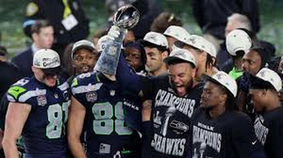 The Seattle Seahawks celebrate with the Vince Lombardi Trophy after defeating the New England Patriots 29-13 Sunday night in Super Bowl LX in Santa Clara, Cal.