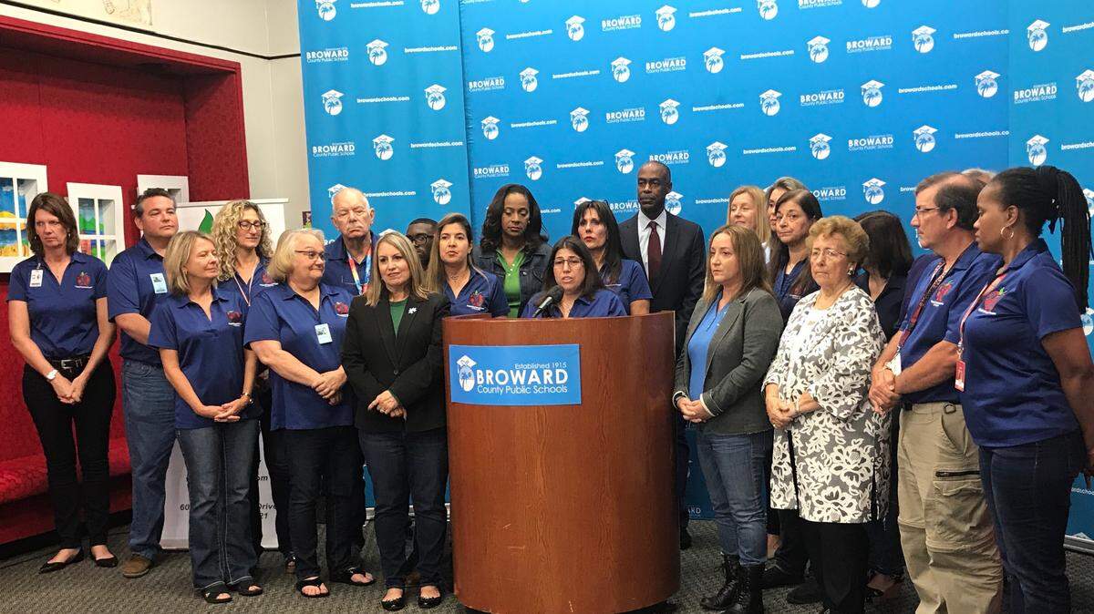 Broward Teachers Union president Anna Fusco, with Broward County Public Schools Superintendent Robert Runcie behind her, discusses the tentative agreement reached by the BTU and BCPS at Wednesday morning’s news conference.