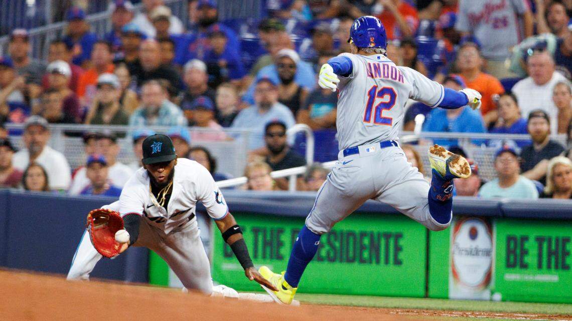 Miami Marlins first baseman Lewin Diaz (34) eyes on the baseball as New York Mets shortstop Francisco Lindor (12) reaches safely into first base during the second inning of a baseball game at LoanDepot Park on Sunday, July 31, 2022 in Miami, Florida.