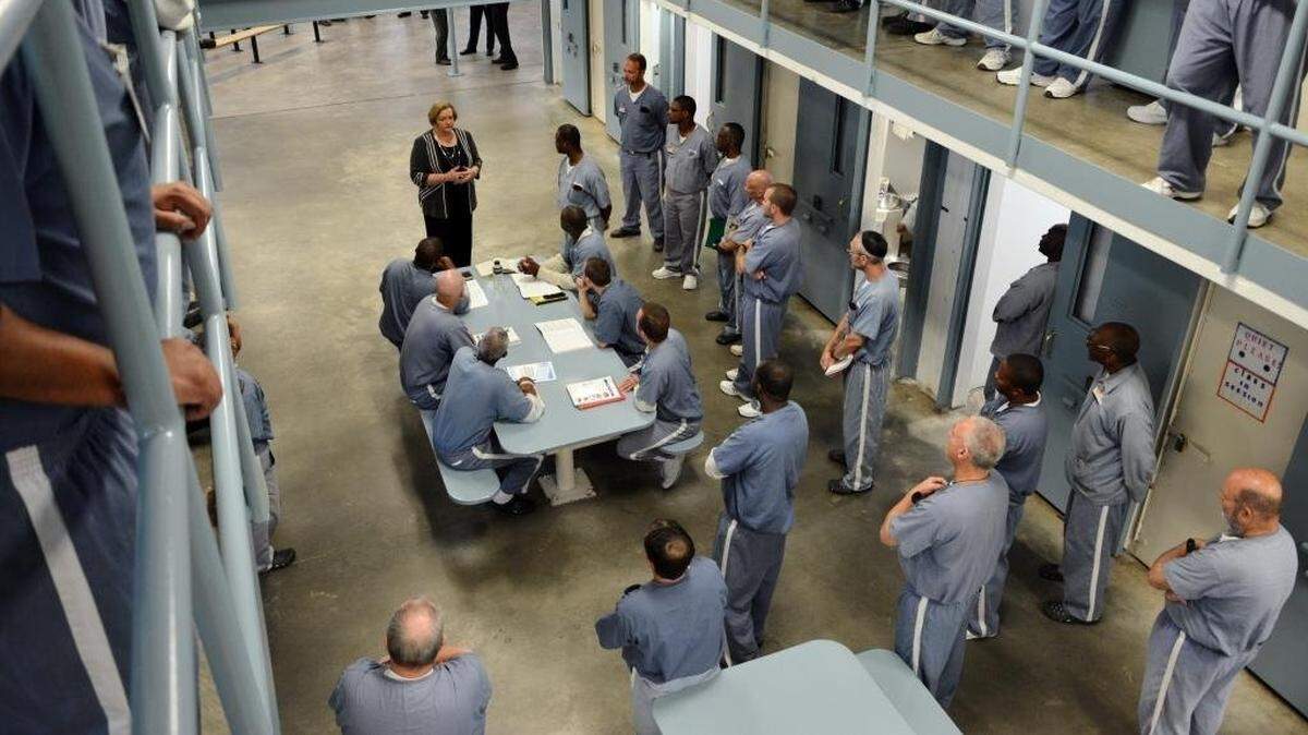 Florida Department of Corrections Secretary Julie Jones visits with Wakulla Correctional Institution inmates, March 8, 2016, during a visit to the Betterment Dorm at the Crawfordville facility.