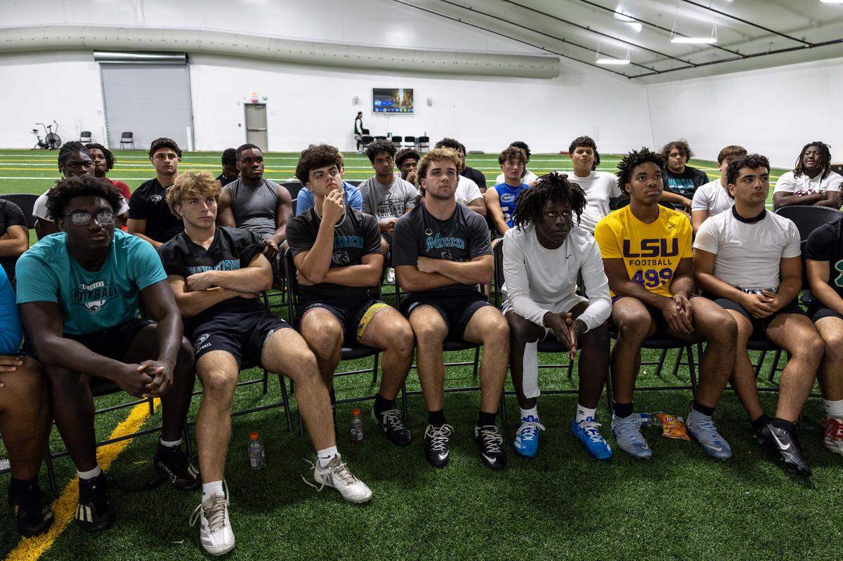 ArchBishop football players watch tape inside the new Jordan Family Foundation Athletic Center at Archbishop McCarthy on Wednesday, October 22, 2025, in Fort Lauderdale, Fla.