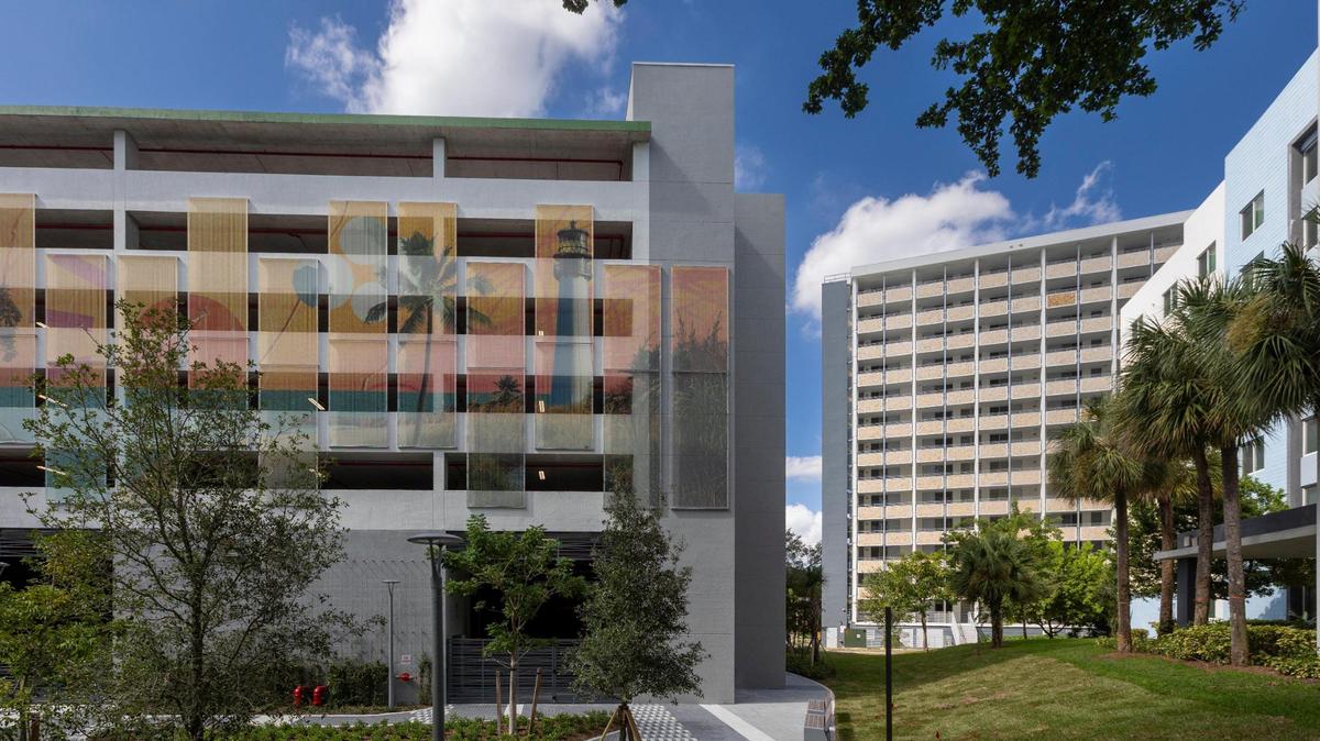 Related Urban and Miami-Dade County celebrated the addition of hundreds of renovated and new affordable, workforce and senior housing apartment rentals in October. Above: Miami, Florida, October 31, 2023 - Paseo del Rio’s parking garage, left and a newly renovated Robert King High, right, form part of River Parc located in Little Havana.