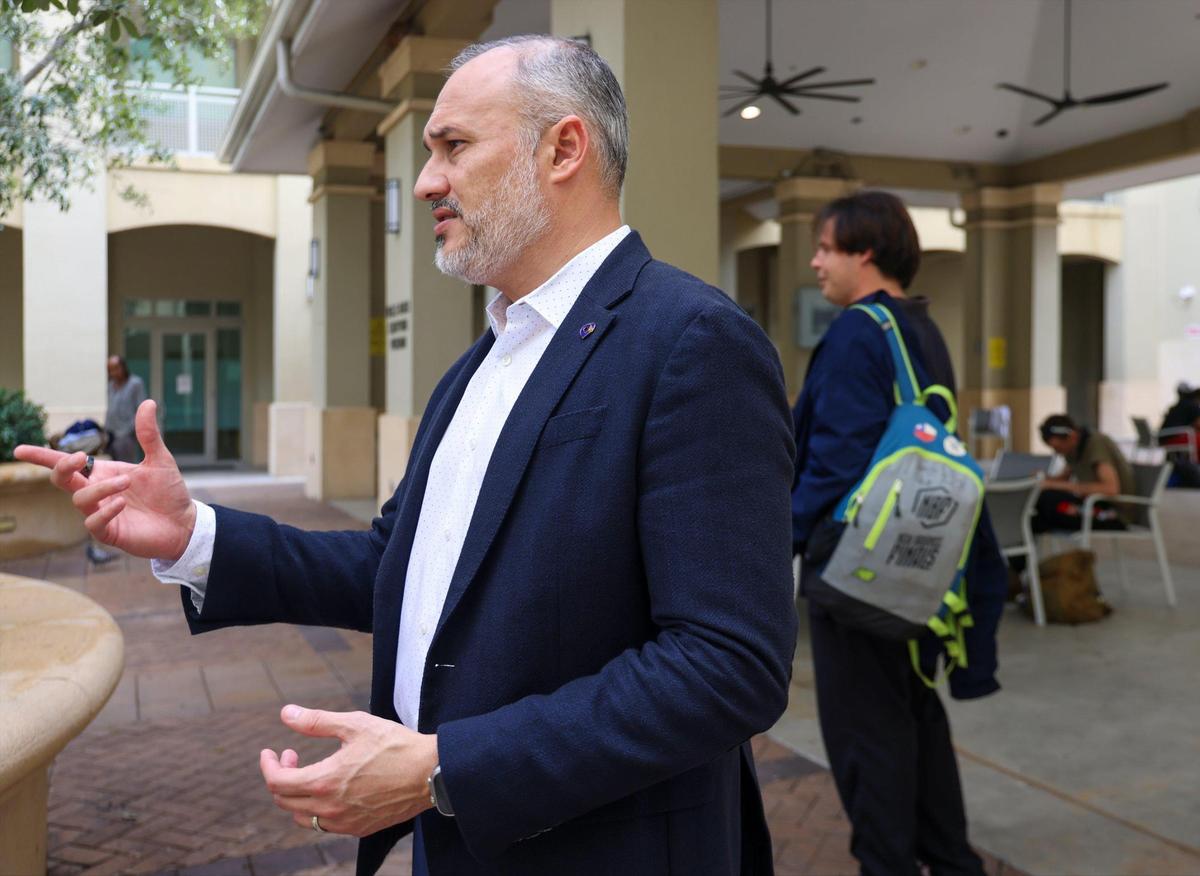 Camillus House CEO Eddie Gloria stands in the shelter’s courtyard as he outlines the services offered to clients on Monday, Nov. 11, 2024, in Miami.