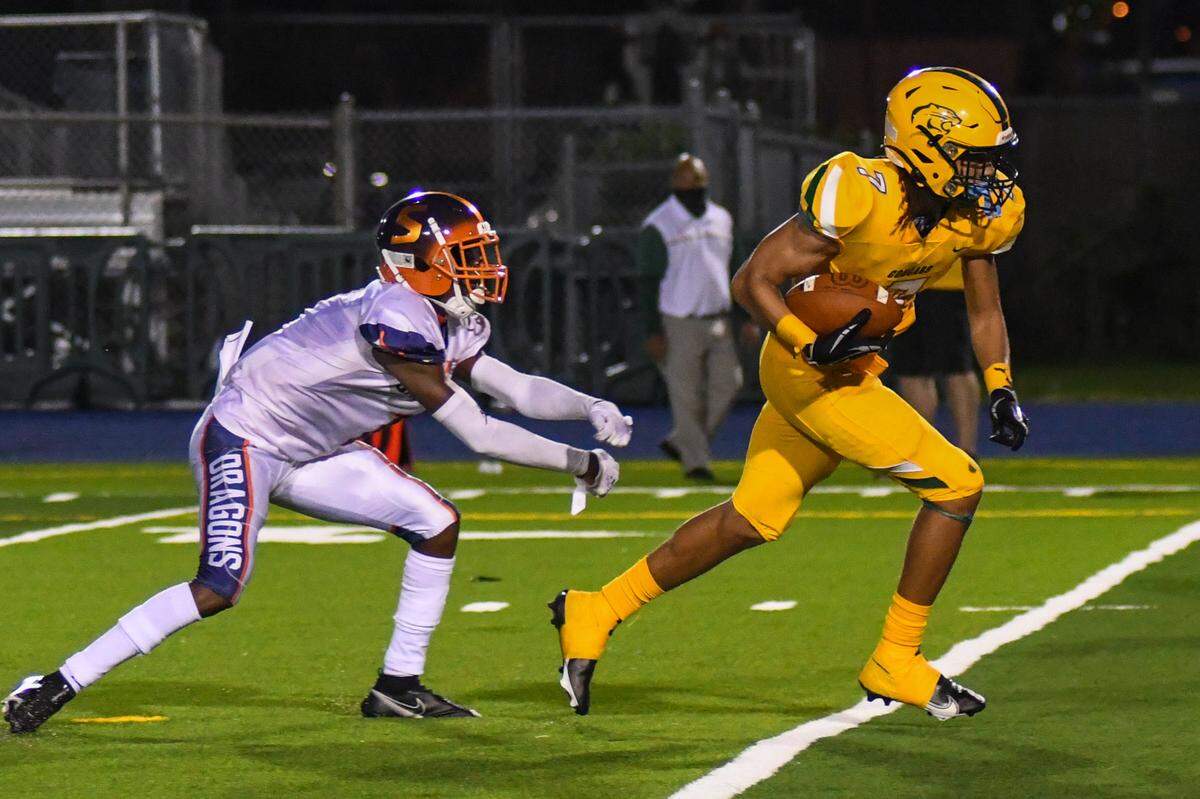 Killian wide receiver Jermaine Hawkins breaks a tackle en route to scoring a second-half touchdown against Stranahan on Saturday, Dec. 5, 2020, at Traz Powell Stadium.