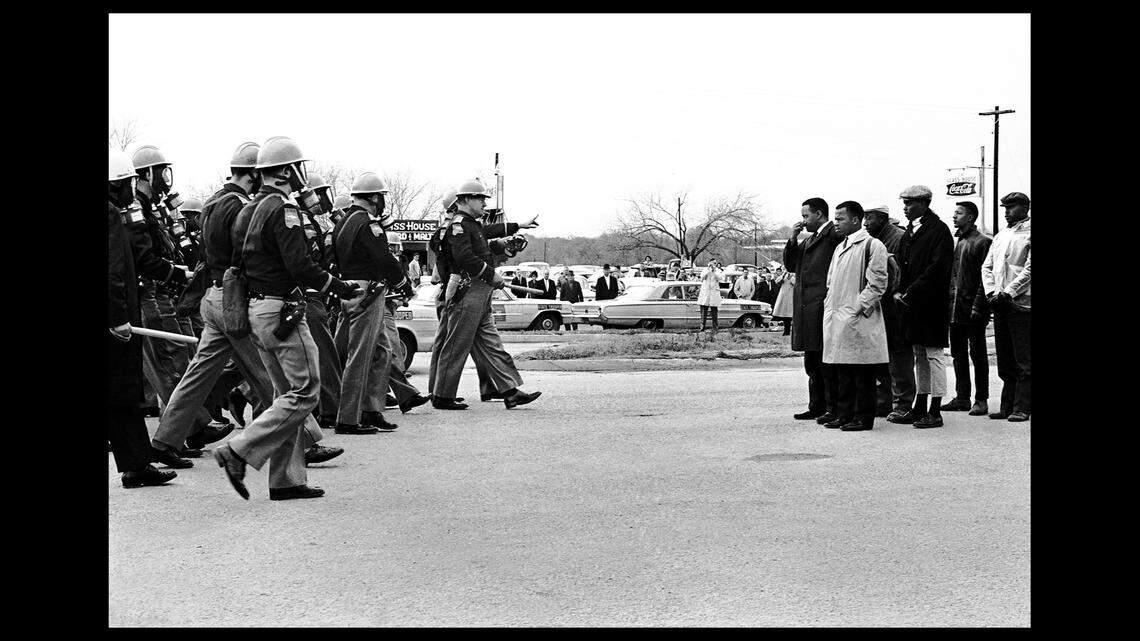 Spider Martin’s “Selma Is Now,” which is featured on the billboard with the MAGA slogan overlaid across it.
