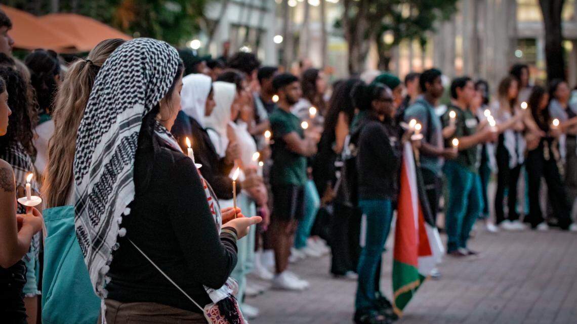 Students gather at a vigil at the University of Miami to honor the thousands of lives lost in the Israel-Hamas war, Monday, Oct. 23, 2023.