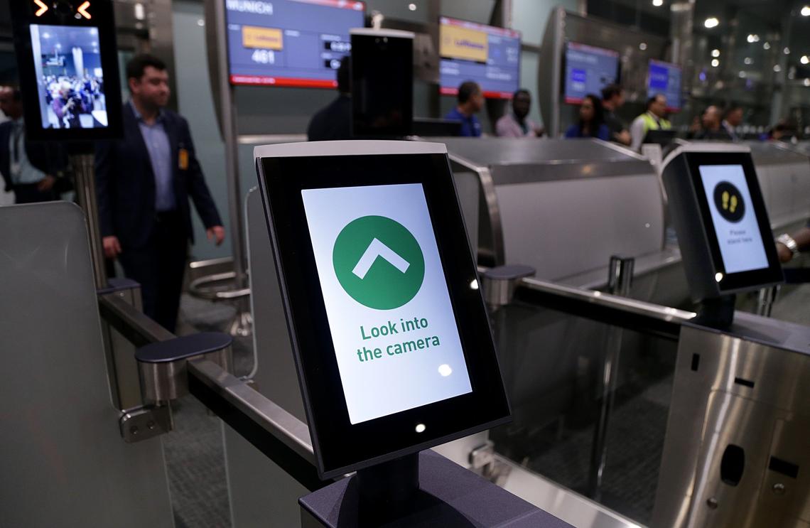 A camera takes a passenger’s photo at Miami International Airport, which on Friday launched its biometric identification system on international flights.