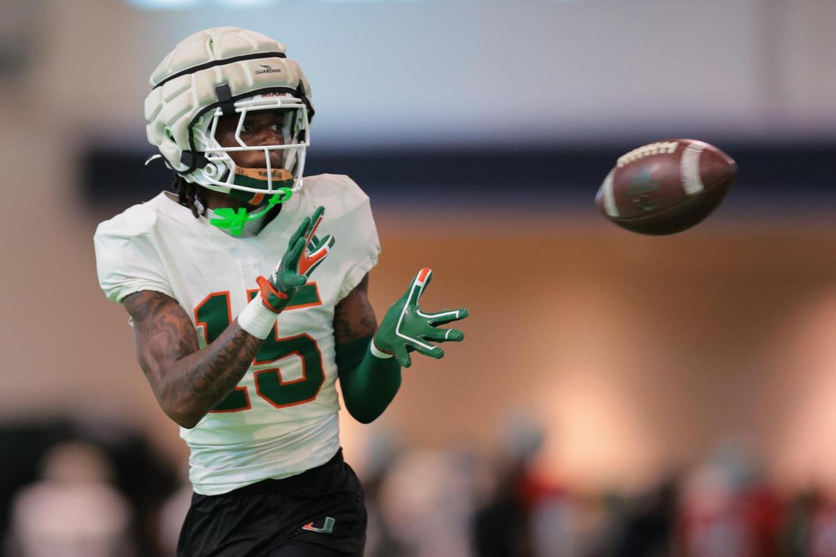 Miami Hurricanes defensive back Markeith Williams (15) catches the football during spring practice at the Carol Soffer Indoor Practice Facility at the University of Miami in Coral Gables, Florida, Tuesday, April 1, 2025.