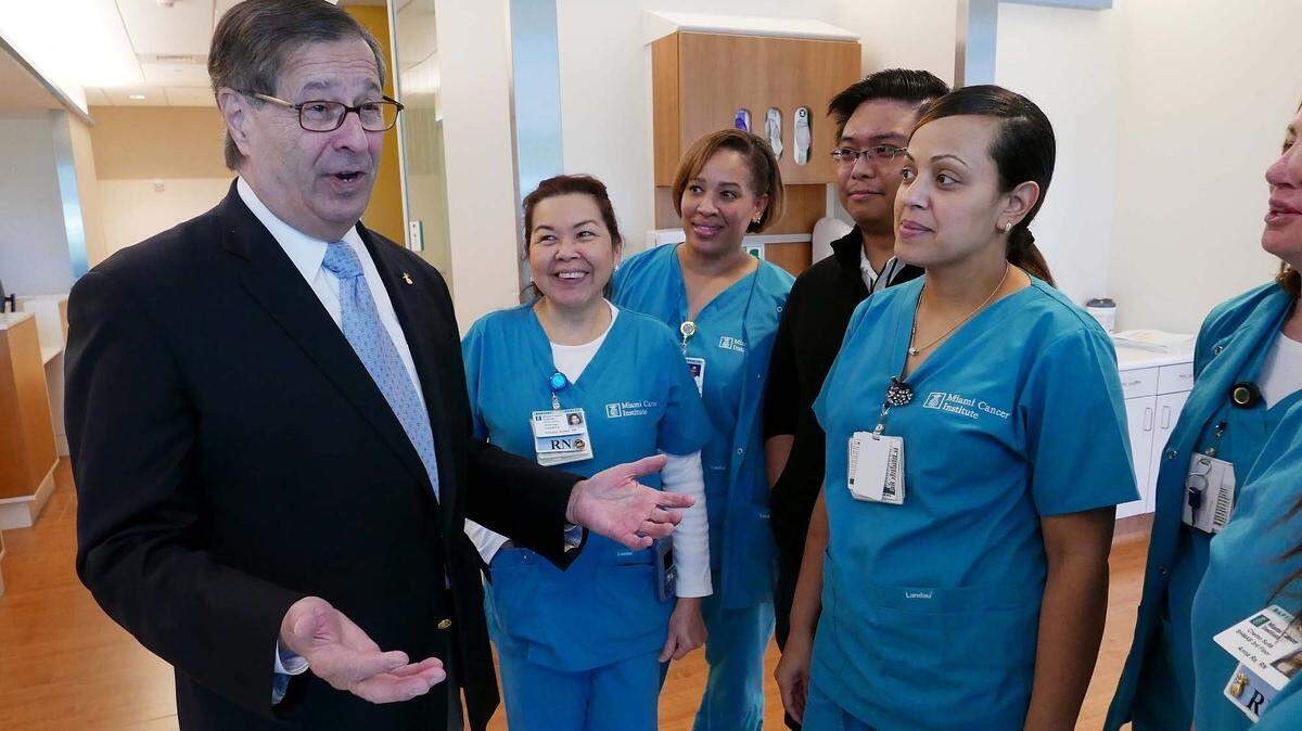 File photo from Jan. 25, 2017, features Dr. Michael Zinner, founding CEO and executive medical director of Miami Cancer Institute at Baptist Health South Florida. He was chatting with some staff members during a tour of the center a day before its 2017 opening.