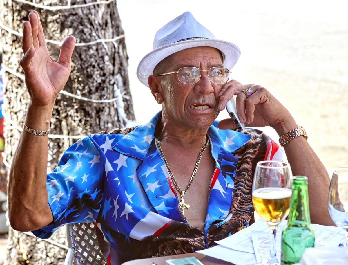 Omar Martinez speaks on his mobile phone outside a restaurant in Little Havana. A scientific study has found that people who talk loudly or shout could be super spreaders of coronavirus. They’ve warned against the increased risks of aerosol transmission of the disease.
