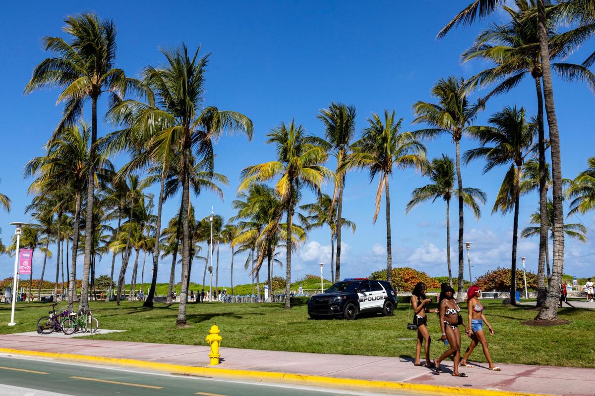 A group of girls walk down Ocean Drive during spring break in Miami Beach on Friday, March 15, 2024.