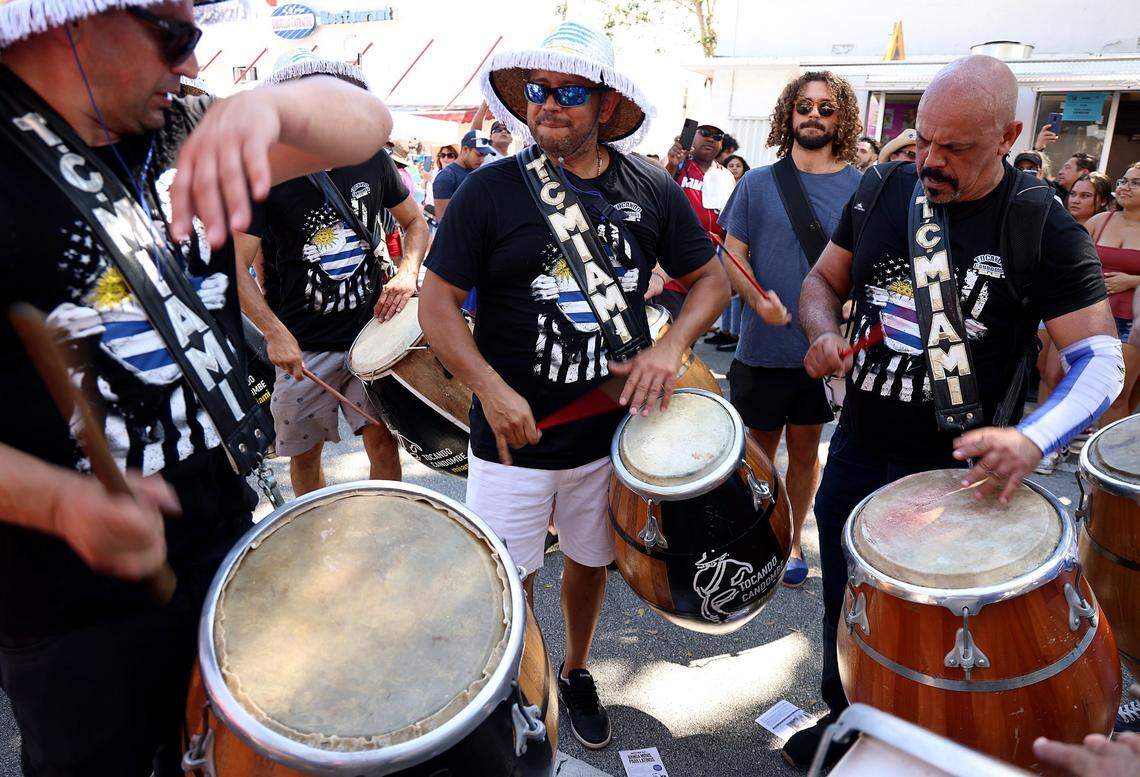 Drummers with Tocando Candombe Miami, a Uruguayan group, perform as they move west on SW 8th Street Sunday during the marquee event of Carnaval Miami, Calle Ocho Music Festival.