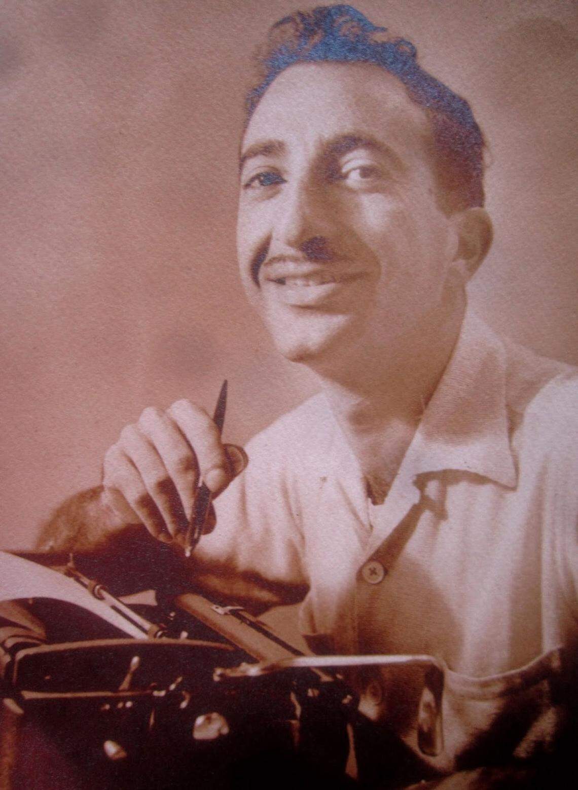 A vintage photo of Charlie Cinnamon at his typewriter, part of the collection featured in the exhibit 'Charlie Cinnamon: Legendary Press Agent' June 19 through September at the Jewish Museum of Florida-FIU.