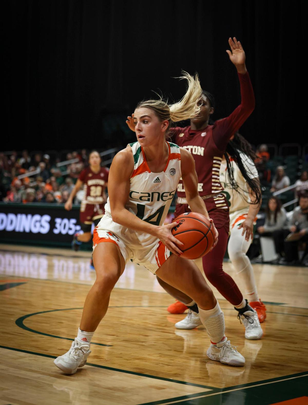 Hurricane’s Haley Cavinder (14) looks for an open teammate during the second quarter of a NCAA women’s basketball game between the University of Miami Hurricanes and Boston College on Thursday, Jan. 26, 2023, in Coral Gables. The score at half time was 41-37 with Boston ahead.